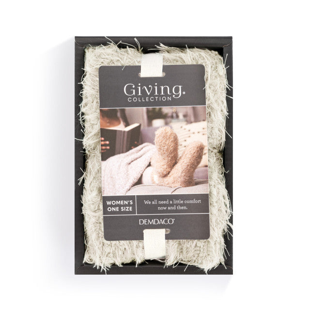Cream fuzzy women’s socks with rubber grippers on the soles, ultra-soft and cozy, part of the Demdaco Giving Collection.