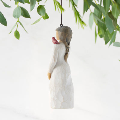 Willow Tree Messenger ornament featuring a woman in a cream dress with a red cardinal on her shoulder.