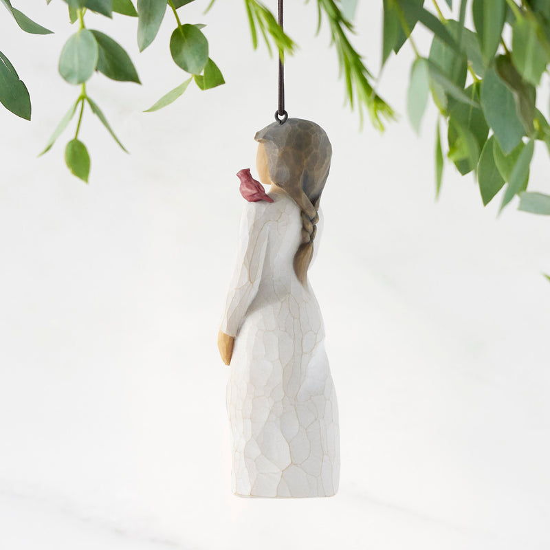 Willow Tree Messenger ornament featuring a woman in a cream dress with a red cardinal on her shoulder.