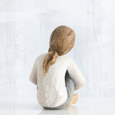 Willow Tree Spirited Child figurine of seated girl with arms wrapped around knees.