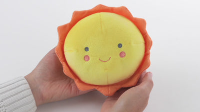 Plush sun toss-around toy with lights and sound effects for interactive play.


