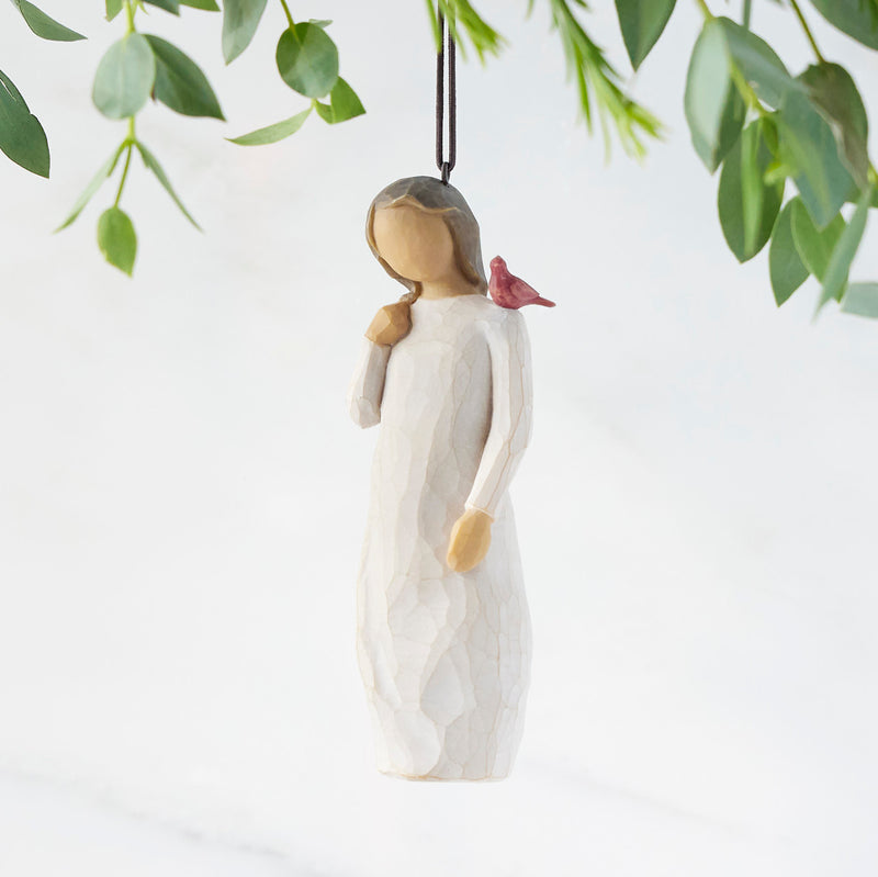 Willow Tree Messenger ornament featuring a woman in a cream dress with a red cardinal on her shoulder.