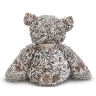 Small beige plush bear with a heart-shaped patch and a "Love" message, soft fabric, 8.5 inches tall, perfect for gifting.

