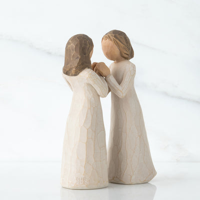 Willow Tree Sisters by Heart figurines, two women in cream dresses with interlocking hands facing each other.