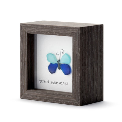 Decorative wooden shadow box with butterfly artwork and Spread Your Wings message, designed for tabletop or wall display.

