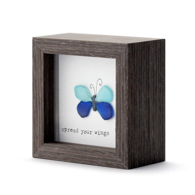 Decorative wooden shadow box with butterfly artwork and Spread Your Wings message, designed for tabletop or wall display.

