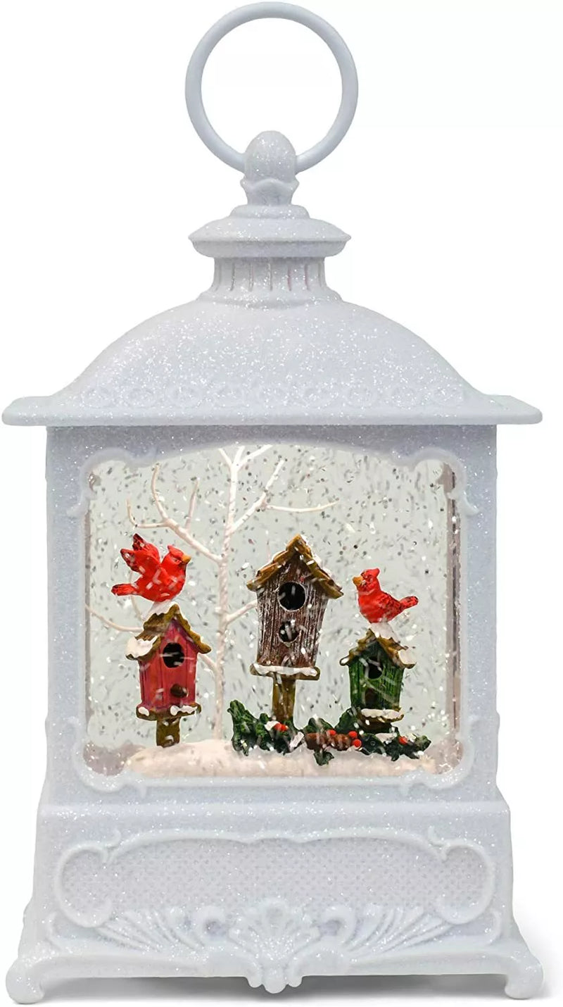 White lantern-style snow globe with red cardinals and birdhouse scene