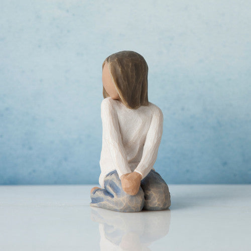 Willow Tree Joyful Child figurine of kneeling girl with darker skin tone and hair.