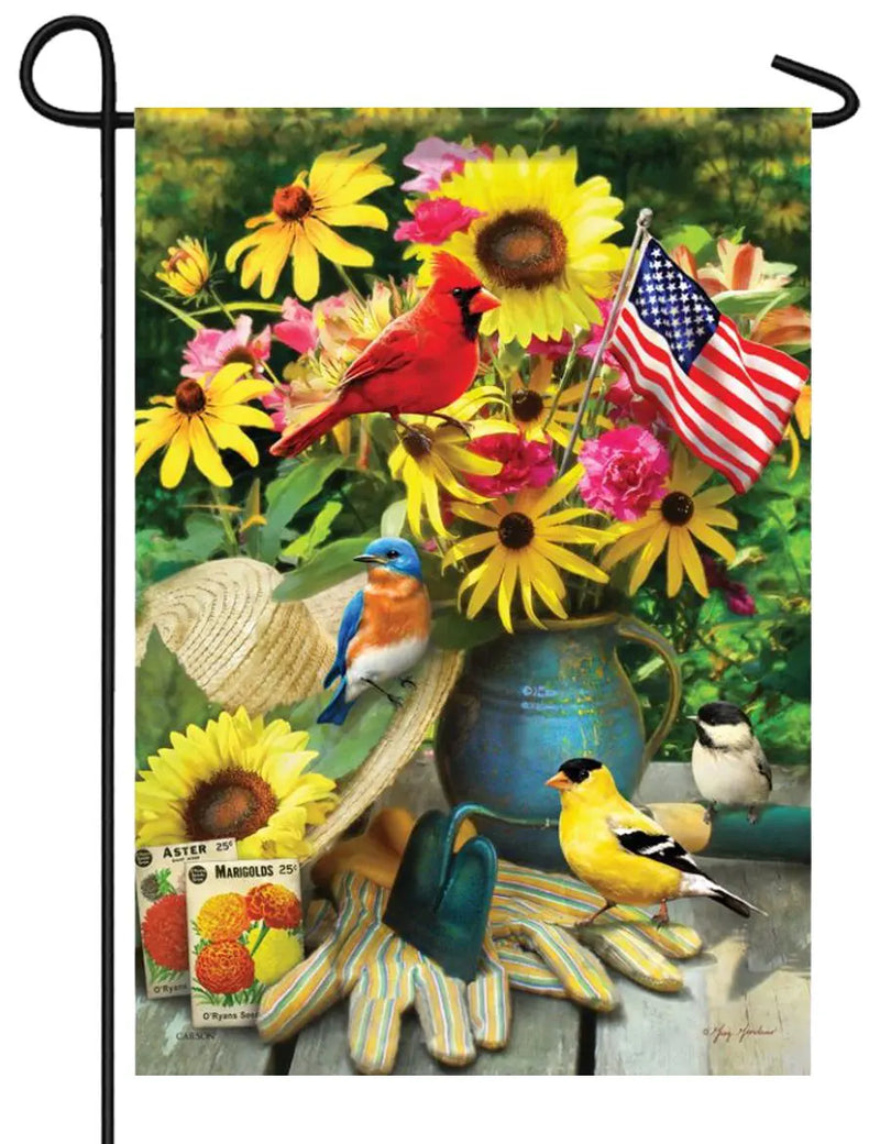 Summer Birds garden flag featuring colorful birds and a floral arrangement with an American flag.