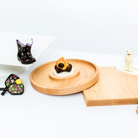 Nora Fleming bonfire mini with sculpted flames and logs; cozy fire-themed accent for gatherings; hand wash only.

