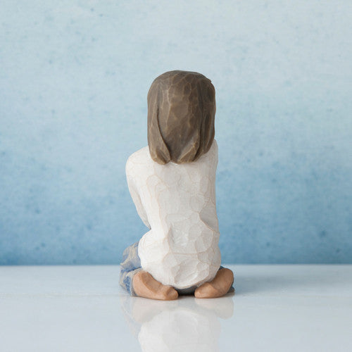 Willow Tree Joyful Child figurine of kneeling girl with darker skin tone and hair.