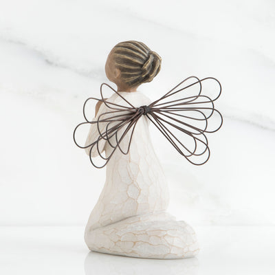 Angel of the Spirit figurine with darker skin tone, kneeling in prayer with wire wings and cream dress.