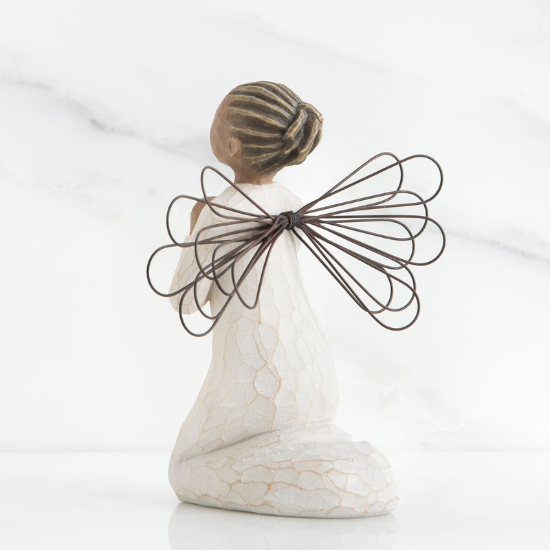Angel of the Spirit figurine with darker skin tone, kneeling in prayer with wire wings and cream dress.
