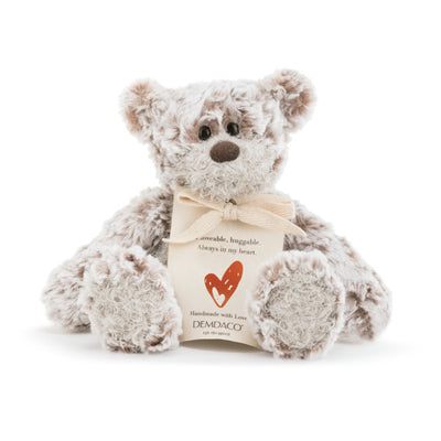 Small beige plush bear with a heart-shaped patch and a "Love" message, soft fabric, 8.5 inches tall, perfect for gifting.

