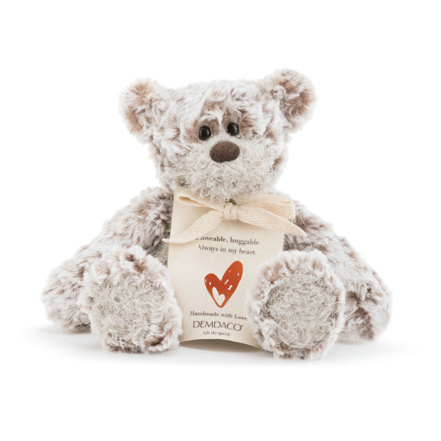 Small beige plush bear with a heart-shaped patch and a "Love" message, soft fabric, 8.5 inches tall, perfect for gifting.

