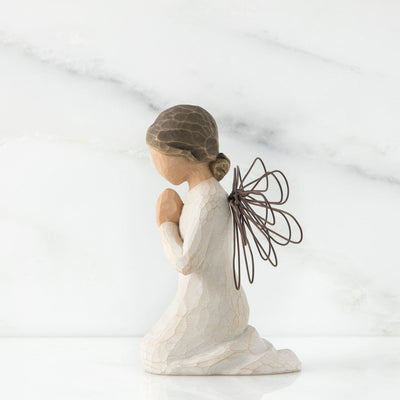 Angel of Prayer, a Willow Tree with a figure of an angel in a cream dress, wire wings, and kneeling with hands in a prayer position.