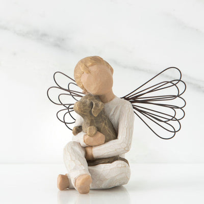 Angel of Comfort, a Willow Tree with a boy angel in a cream onesie, seated with a brown dog in his lap