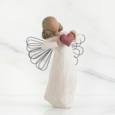 With Love - Willow Tree with Standing angel with darker skin tone and hair color, in a cream dress with wire wings, a red heart in her hands.