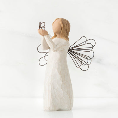 Angel of Freedom, a Willow Tree with a standing angel in a cream dress with wire wings, holding a wire butterfly in extended hands.