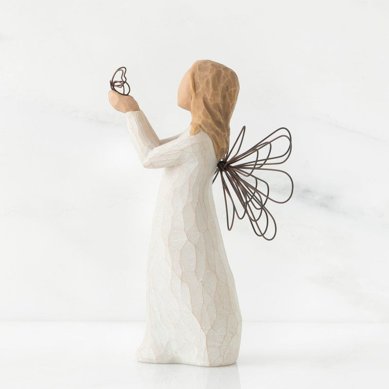 Angel of Freedom, a Willow Tree with a standing angel in a cream dress with wire wings, holding a wire butterfly in extended hands.