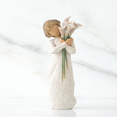 Beautiful Wishes, a Willow Tree with a standing figure in a cream dress, holding a tall bouquet of white calla lilies