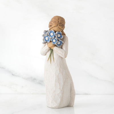 Forget-me-not: Willow Tree in a cream dress, holding a large bouquet of blue forget-me-not flowers up to her face.