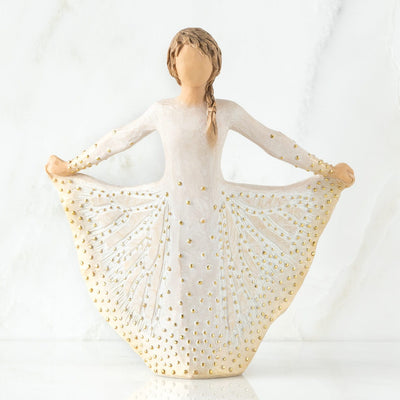Butterfly - Willow Tree in a cream dress,monarch butterfly, dotted with gold leaf, holding the sides of her skirt out with both hands.