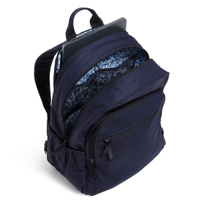 Exterior features include two side slip pockets and a hidden back zip pocket.