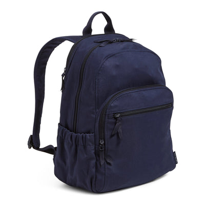 Exterior features include two side slip pockets and a hidden back zip pocket.