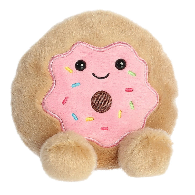 Pink plush donut with rainbow sprinkles and a bite taken out