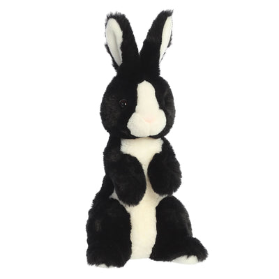 Black and white plush rabbit with floppy ears and stitched smile.