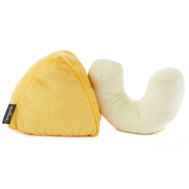 The set of two mac and cheese stuffed toys is made of soft plush fabric and features embedded magnets for connecting to each other. on the back side