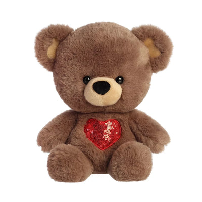 His cozy brown teddy bear has heart detailing in its inner ears and a big red sequin heart embroidered in the center of its body.