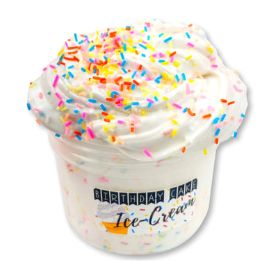 Ice cream cup with vanilla and chocolate ice cream topped with whipped cream, sprinkles, and a cherry. Text on cup reads Ice-Cream