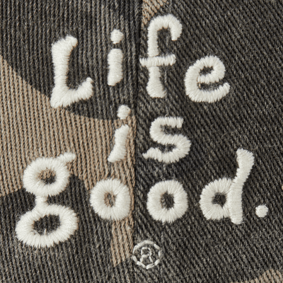 Camo six-panel Chill Cap with vintage wordmark stacked embroidery, soft 100% cotton, adjustable snapback, Life is Good label


