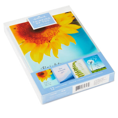 The Thinking of You greeting card assortment pack includes 12 cards and envelopes: 3 of each of the four designs.