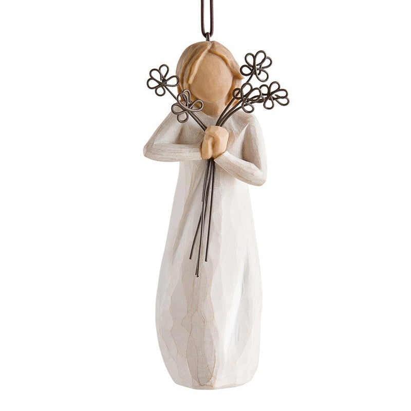 Friendship Ornament – Willow Tree with in cream dress holding five wire flowers with long stems in front of her face.