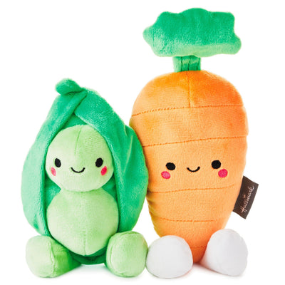 Peas and carrot stuffed toys are made of soft plush fabric and feature embedded magnets for connecting to each other.