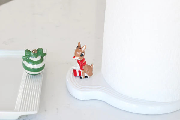 White ceramic paper towel holder with a red-nosed reindeer design