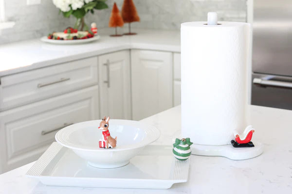 White ceramic paper towel holder with a red-nosed reindeer design