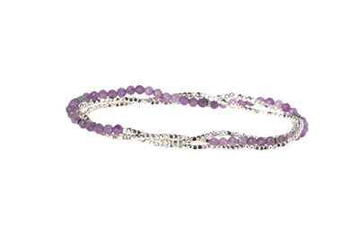 Faceted gemstones mix with tiny geometric metal beads to create a subtle and magical piece.