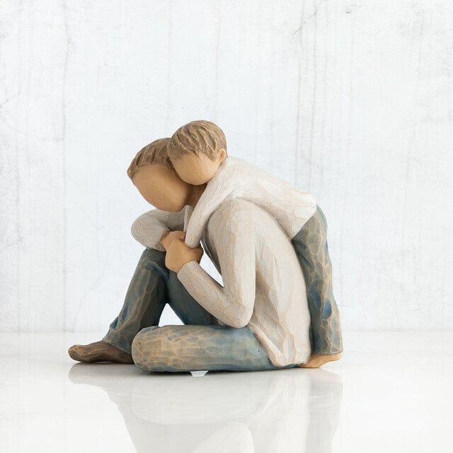 Willow Tree line of sculptures created by Susan Lordi. It depicts a father and son embracing