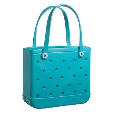 Turquoise handbag with gold chain detail, handles, and button closure