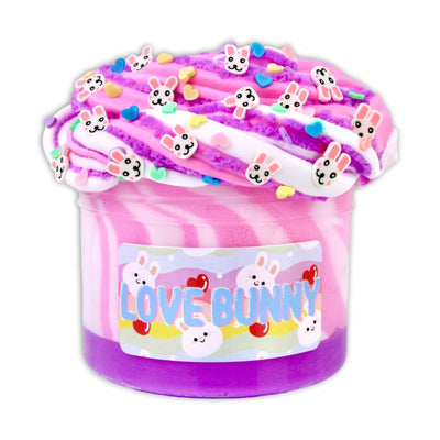 Pink and purple slime with bunny sprinkles in a plastic container. Text on container reads “3  VE BUNNY