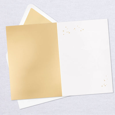 Blank greeting card features a layered, dimensional attachment of Cinderella's carriage with gold foil