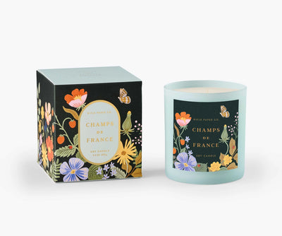 The 9.5-ounce soy wax candle comes in a painted glass vessel and is packaged in a decorative gift box with gold foil accents.