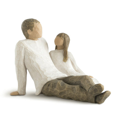 Willow Tree's New Dad figurine is a timeless sculpture capturing the awe and wonder of a new father holding his baby.