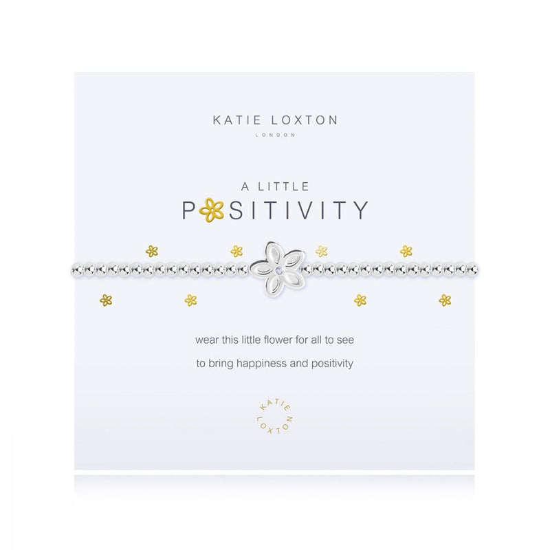 features a rose gold wine glass charm and is presented on a branded card with the "a little positives" title in rose gold.