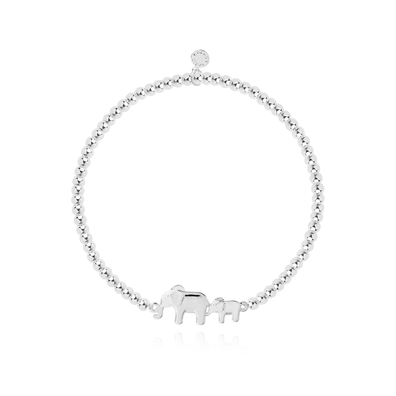 Silver-plated bracelet with heart charm on a card that reads &