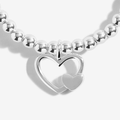 Boxed bracelet with gold-embossed 'Happy Mother's Day' sentiment and silver charm inside.

